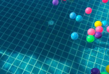 Assorted color balls floating on water